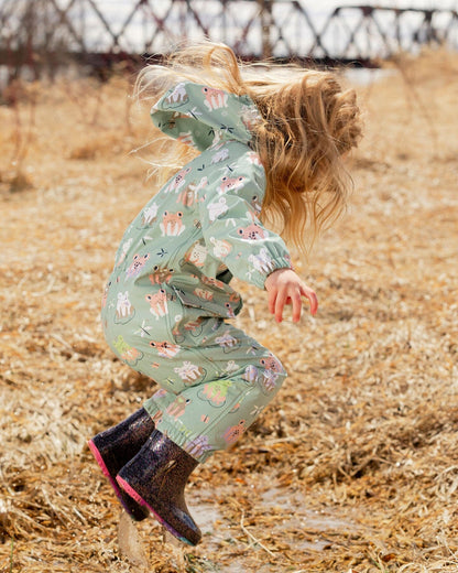 Green rain jumpsuit with color-changing frogs print